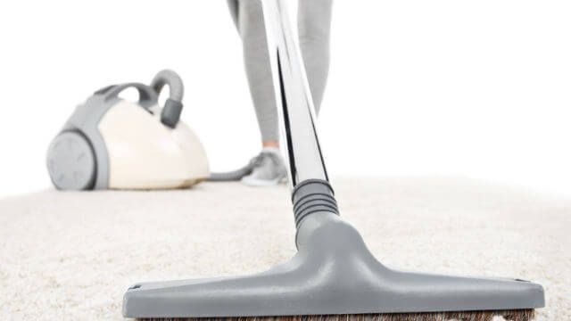 Vacuuming carpet