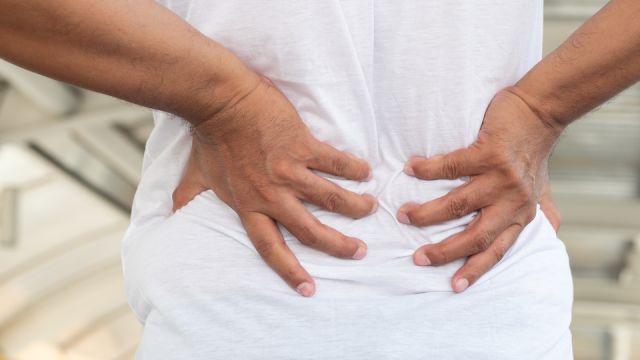 old man suffering from back pain or kidney failure