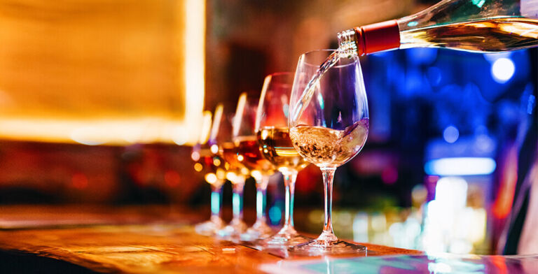 Why That Nightcap Might Be Blocking Your Morning Poop, According to Experts